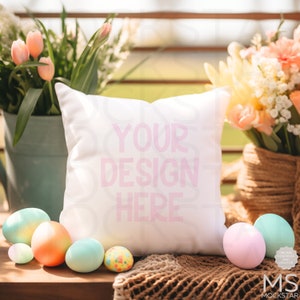 May include: White pillow with the text "YOUR DESIGN HERE" in pink lettering, surrounded by pastel colored Easter eggs and spring flowers.