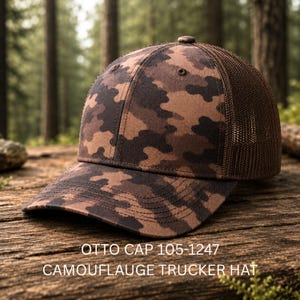 May include: A brown camouflage trucker hat with a mesh back and a curved brim. The front panel features a brown and dark brown camouflage pattern. The text OTTO CAP 105-1247 CAMOUFLAUGE TRUCKER HAT is printed in white at the bottom of the image.