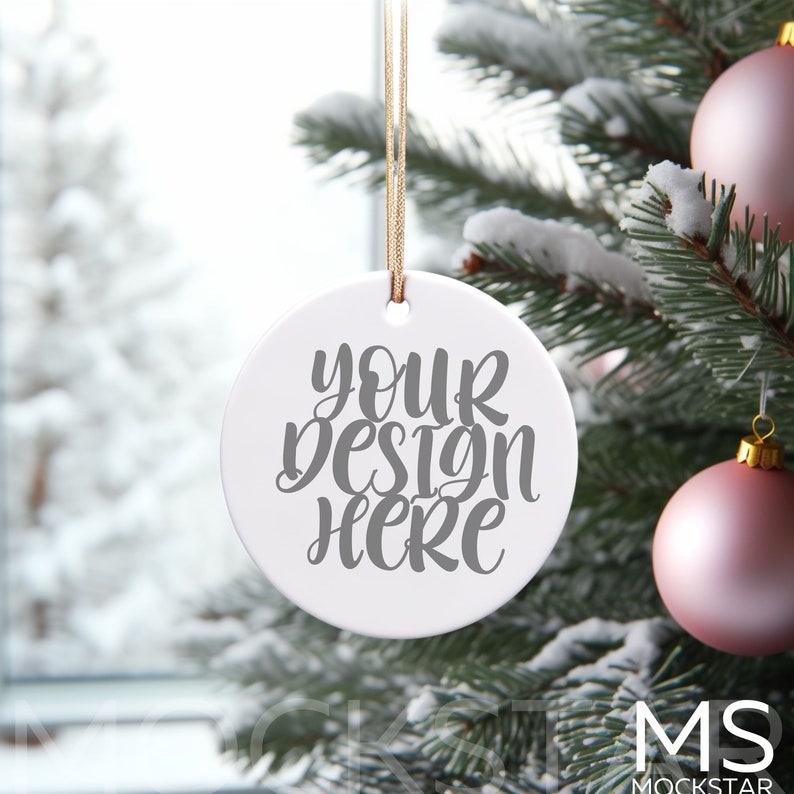 May include: White ceramic Christmas ornament with a string for hanging. The ornament has the text "your design here" written in gray cursive.