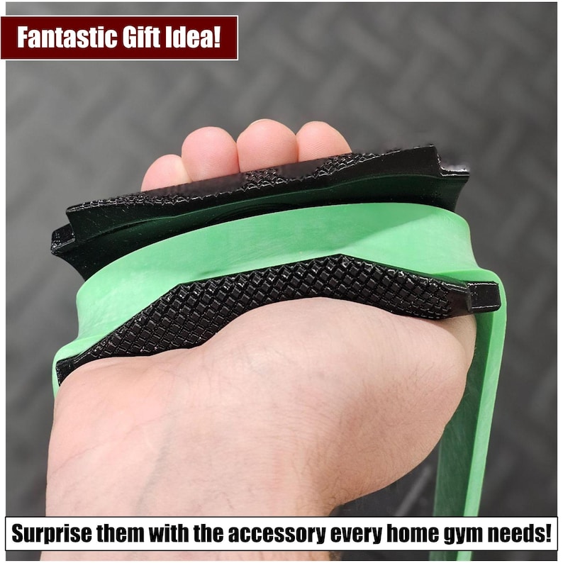 May include: A black and green exercise resistance band with a textured surface. The band is being held in a hand.