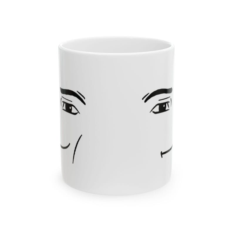 May include: White ceramic mug with a black line drawing of a face with raised eyebrows and a smirk on each side.