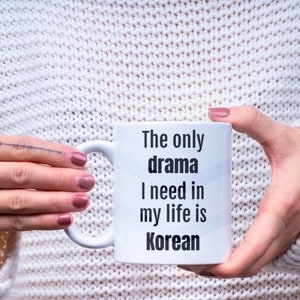 May include: White ceramic mug with black text that reads "The only drama I need in my life is Korean".