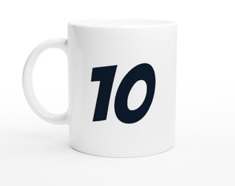 May include: White ceramic mug with a black number 10 printed on the front.