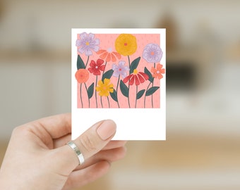May include: A colourful floral illustration on a white background. The artwork features various flowers in shades of red, orange, yellow, and purple, with green leaves and stems. The background is a light pink with small dots.