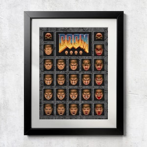May include: Framed print featuring the word "DOOM" in a pixelated font, with a grid of pixelated faces below. The artwork is set against a dark background and framed in black.