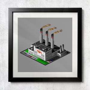 May include: Framed print of a pixelated industrial building with three smokestacks emitting smoke. The building is gray with red accents and a green lawn. The artwork is set against a gray background and framed in black.