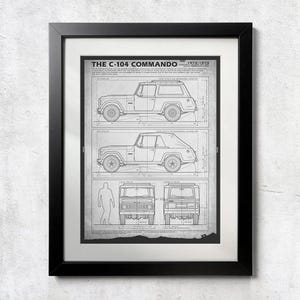 May include: Framed black and white print of a vintage C-104 Commando vehicle blueprint. The print shows side and front views of the vehicle, along with the text "THE C-104 COMMANDO" and the years 1972-1973.