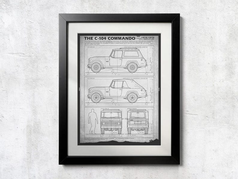 May include: Framed black and white print of a vintage C-104 Commando vehicle blueprint. The print shows side and front views of the vehicle, along with the text "THE C-104 COMMANDO" and the years 1972-1973.