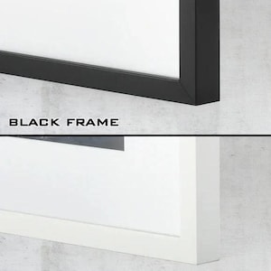 May include: A split-view display showing two rectangular picture frames. The top section features a black frame with the text BLACK FRAME below it. The bottom section features a white frame with the text WHITE FRAME below it. Both frames include a white mat.