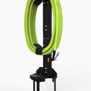 May include: Black metal garden hose holder with a green hose wrapped around it. The holder has three metal stakes that can be inserted into the ground.