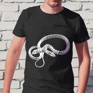 May include: A black t-shirt featuring a white graphic of a snake coiled in a circle.