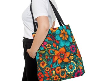 May include: A black tote bag with a colorful floral pattern. The pattern features orange, yellow, blue, green, and pink flowers on a dark blue background.