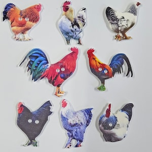 May include: A set of eight colourful rooster and hen buttons. The buttons feature a variety of colours and patterns, including red, blue, green, white, and black. The buttons are perfect for adding a touch of whimsy to any craft project.