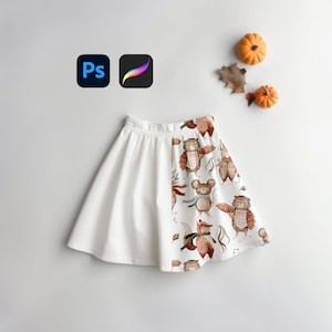 May include: A white skirt with a brown and white woodland animal print on one side. The print features owls, bears, and foxes.