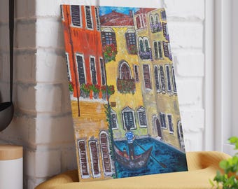 May include: A painting depicting a Venetian canal scene. Buildings with orange, yellow, and beige facades are visible. A gondola with a gondolier in a striped shirt floats on the blue water. Red flowers decorate some balconies.