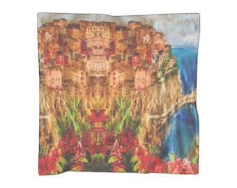 May include: A watercolour painting of a colourful Italian village on a cliffside overlooking the ocean. The village is painted in shades of red, orange, yellow, and brown. The ocean is painted in shades of blue and green. There are red flowers in the foreground.