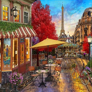 May include: A Parisian street scene with a carousel, a cafe, and the Eiffel Tower in the background. The cafe has red and white striped awnings and tables and chairs set up outside. There are red and yellow fall leaves on the ground.
