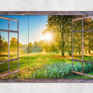 May include: A wooden window frame with a view of a green field and trees. The sun is shining through the trees, creating a warm glow. The window is open, and the light is streaming in.