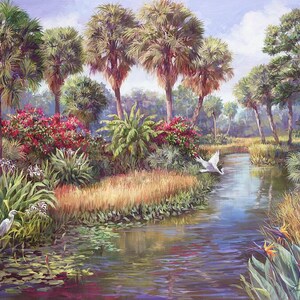 May include: A painting of a tranquil Florida swamp scene with a winding river, lush greenery, and palm trees. Two white egrets are flying over the water, one in flight and one perched on a branch. The scene is bathed in warm sunlight.