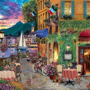 May include: A colorful painting of a cafe in a European village. The cafe has a red awning with the word "Rugantino" written on it. There are tables and chairs set up outside the cafe, and a bicycle is parked nearby. The painting is set against a backdrop of a lake and mountains.