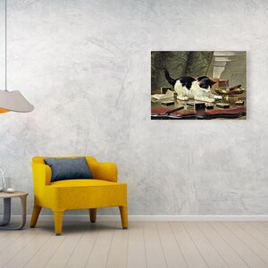 May include: A framed painting depicts a black and white cat on a table with various objects. The cat is the focal point, with its tail raised. The table is covered with small boxes and other items. The painting is displayed on a textured wall.