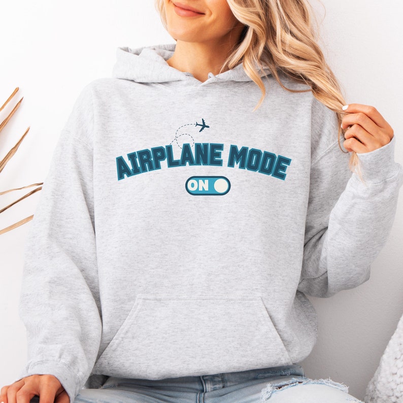 May include: A gray hoodie with a blue graphic that says "Airplane Mode On" with a stylized airplane and a toggle switch.