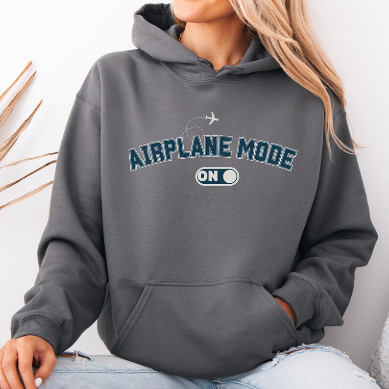 May include: A dark gray hoodie with the text "AIRPLANE MODE ON" in blue and white lettering. A small airplane icon is above the text.