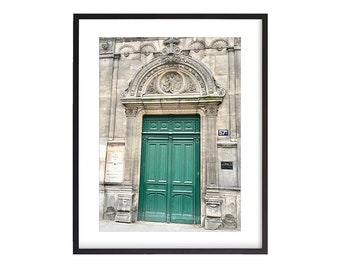 May include: A green double door with ornate stonework above it. The door is set in a stone building with the number 57 above it.