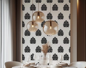 May include: A dining room scene featuring a round white table set for a meal. Above the table, three spherical pendant lights with amber-colored glass hang from the ceiling. The wall is decorated with a repeating black and white pattern.