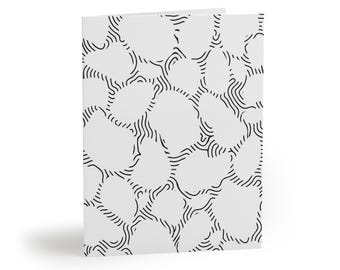 May include: A folded greeting card featuring a white background with a repeating black line pattern. The design consists of irregular, rounded shapes outlined by concentric, flowing black lines that create a topographical map effect.