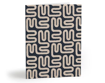 May include: A folded greeting card featuring a repeating pattern of thick, beige, interconnected squiggly lines set against a solid dark navy blue background. The lines create a continuous, maze-like geometric design across the entire front cover.