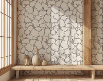 May include: A room interior featuring a light-colored wall with a repeating black pattern. A wooden bench holds three ceramic vases. The room has a wooden floor and a large window with wooden frames. The overall aesthetic is minimalist and natural.