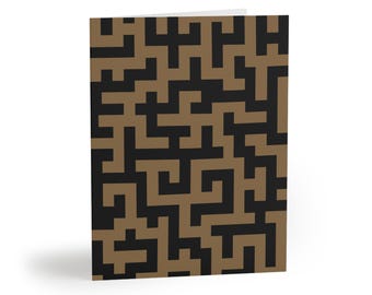 May include: A rectangular greeting card featuring a repeating geometric pattern of interlocking black and tan lines. The design consists of thick, angular shapes that connect to form a continuous maze-like structure across the entire surface.
