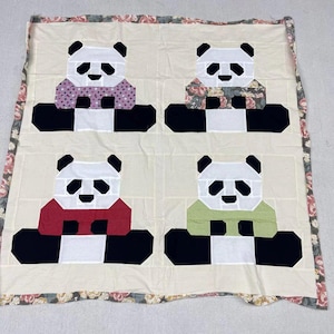 May include: A set of three ceramic mugs with a speckled, matte finish. The mugs are in shades of cream, light gray, and dark gray. Each mug has a simple, minimalist design, perfect for coffee or tea.