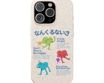 May include: A beige phone case with a graphic design featuring Japanese text and colorful heart-shaped characters. The case includes the phrases "Don't Worry, Be Happy," "It'll Be Alright," and "Everything Will Work Out."