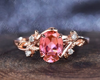 Anillo de compromiso vintage con zafiro Padparadscha ovalado y banda floral de oro rosa