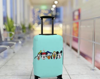 May include: A turquoise suitcase featuring a print of Mickey Mouse and his friends. The suitcase has black wheels and a black handle.