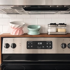 Handmade walnut stove top organizer shelf with adjustable size for different stove lengths and back panel heights ideal for creating extra kitchen storage and displaying spices oils jars and cooking supplies in a clean stylish way