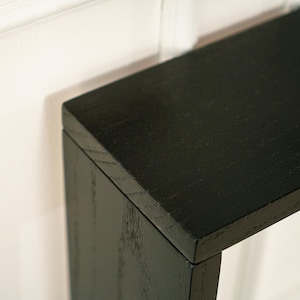 Modern farmhouse narrow console table with storage shelves and black wood finish designed for entryway hallway and living room furniture layouts perfect for behind couch placement in apartments contemporary homes and rustic interiors this long slim console table is ideal for displaying lamps books plants candles baskets and decorative accessories while adding warmth style organization and functional storage to any space