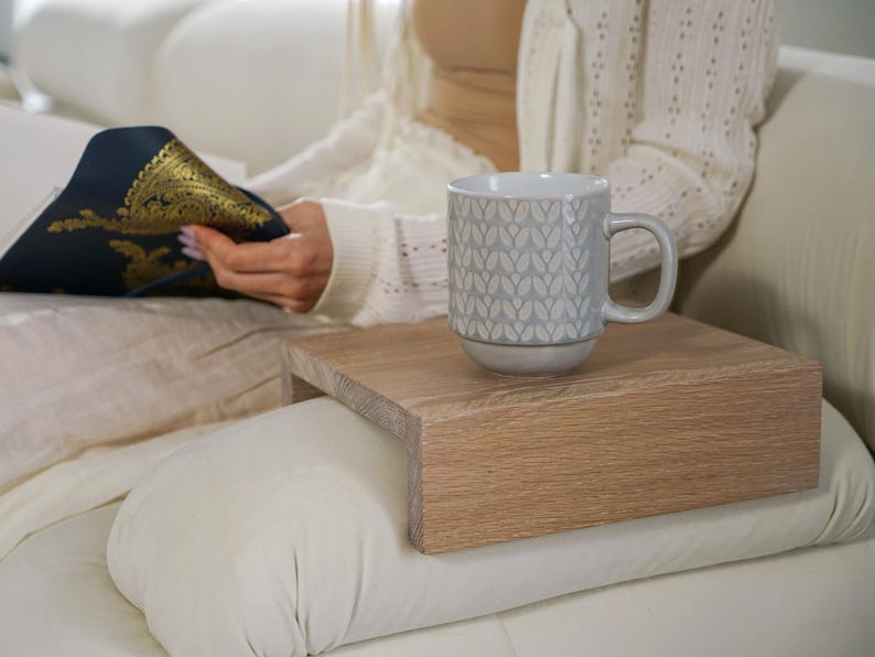 White oak couch arm tray table handcrafted for functionality and style serves as a sofa armrest table or wood side table designed for small spaces it provides a stable surface for drinks or snacks fits securely on most sofa arms and enhances the look of any modern or rustic interior