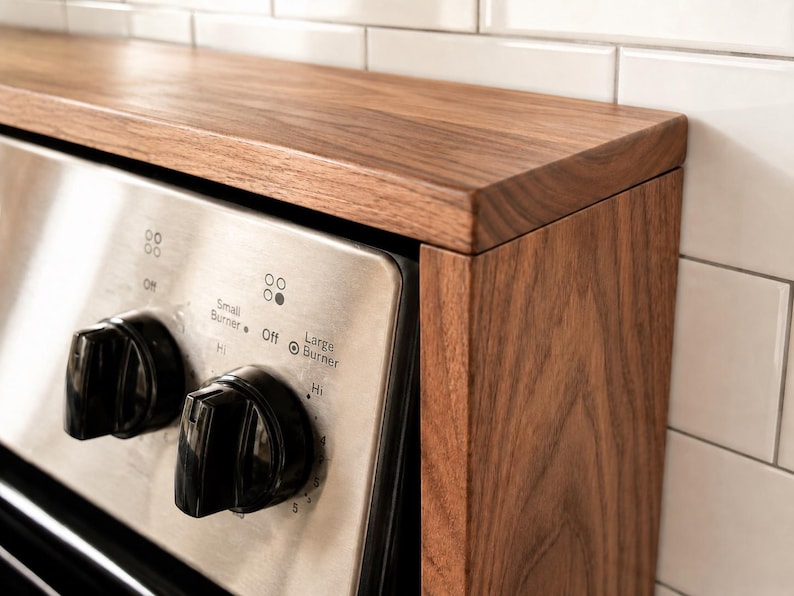 Handmade walnut stove top organizer shelf with adjustable size for different stove lengths and back panel heights ideal for creating extra kitchen storage and displaying spices oils jars and cooking supplies in a clean stylish way