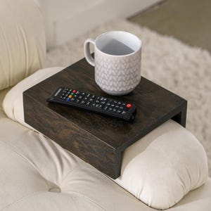 Sofa arm tray table made from solid white oak fits over the arm of your couch to create a convenient and sturdy surface for daily use perfect for holding snacks coffee remotes or a phone this wood couch side table adds function and style to compact living spaces with a clean natural finish