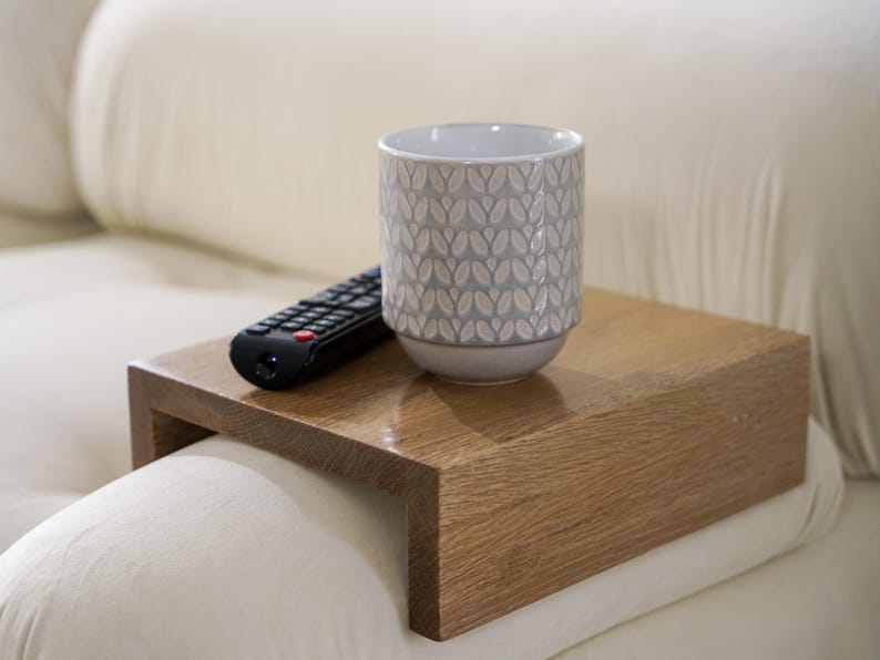 White oak couch arm tray table handcrafted for functionality and style serves as a sofa armrest table or wood side table designed for small spaces it provides a stable surface for drinks or snacks fits securely on most sofa arms and enhances the look of any modern or rustic interior
