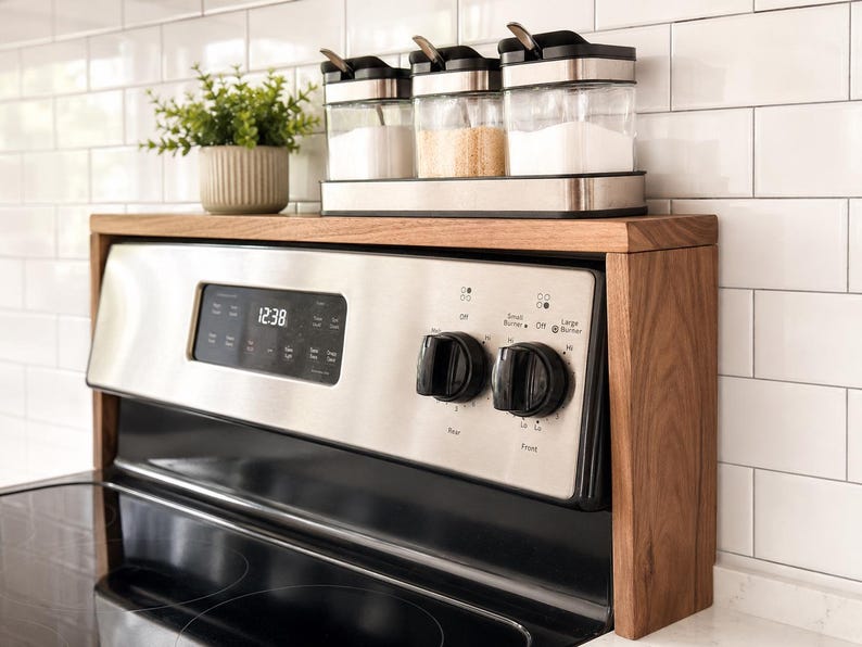 Handmade walnut stove top organizer shelf with adjustable size for different stove lengths and back panel heights ideal for creating extra kitchen storage and displaying spices oils jars and cooking supplies in a clean stylish way