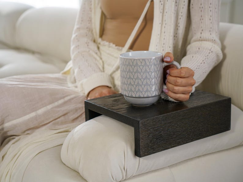 Sofa arm tray table made from solid white oak fits over the arm of your couch to create a convenient and sturdy surface for daily use perfect for holding snacks coffee remotes or a phone this wood couch side table adds function and style to compact living spaces with a clean natural finish
