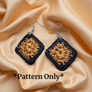 May include: A pair of crocheted earrings with a black and gold square design. The earrings are hanging from silver hooks. *Pattern Only*