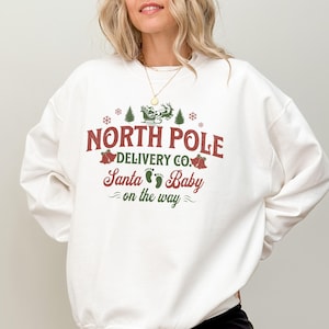 Christmas Pregnancy Announcement Sweatshirt, Christmas Maternity Shirt, Christmas Pregnancy Reveal Crewneck, Holiday Gift for Mother To Be