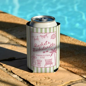 May include: A white and green striped can cooler with the text "Rachel's Bachelorette Charleston 2026" in pink. The cooler features illustrations of a bikini, sunglasses, a disco ball, a palm tree, and a beach chair.
