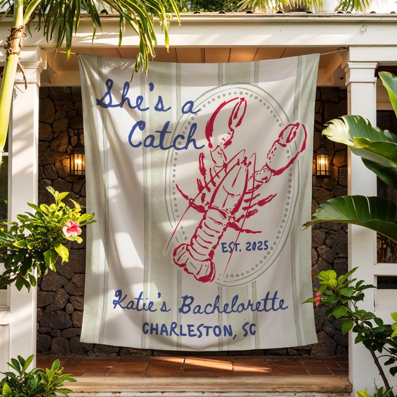 May include: A white and green striped banner with the text "She's a Catch" in blue script. A red lobster illustration is centered, with "EST. 2025" below. The banner reads "Katie's Bachelorette, Charleston, SC."