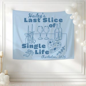 May include: Light blue wall tapestry with the text "Hailey's Last Slice of Single Life" and illustrations of wine glasses, bottles, candles, and a heart-shaped pizza. The text "Charleston, 2025" is also included.